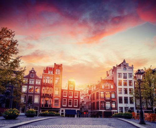 Amsterdam canal on the west. Amsterdam is the capital and most densely populated city in the Netherlands. - Shutterstock