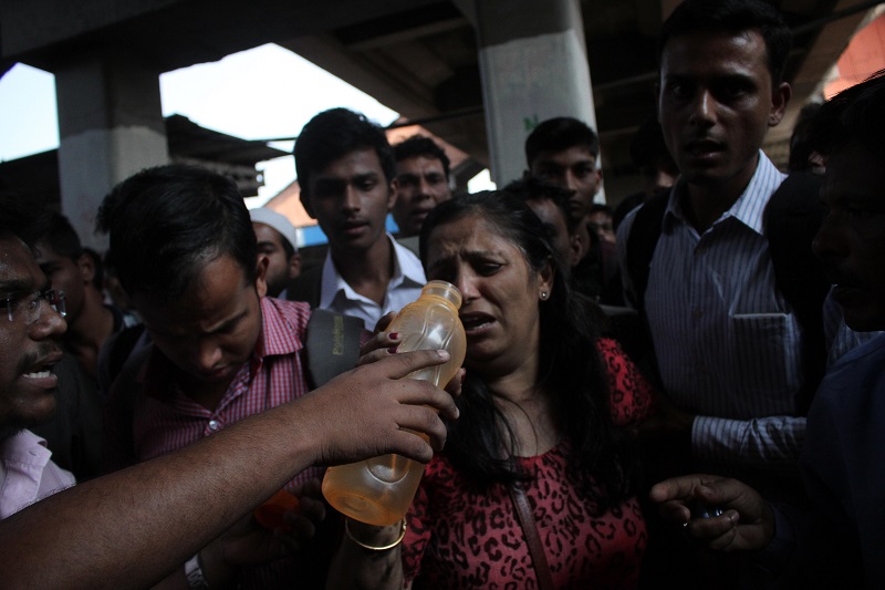Woman Trapped Under The Wheels Of Mumbai Local Train (Image Courtesy - Anushree Fadnavis - Indus Images)