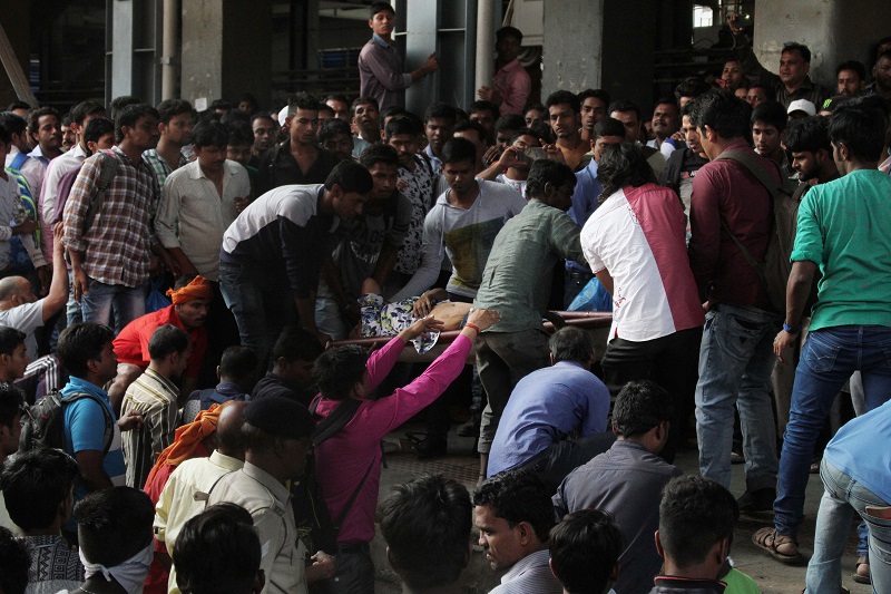 Woman Trapped Under The Wheels Of Mumbai Local Train (Image Courtesy - Anushree Fadnavis - Indus Images)